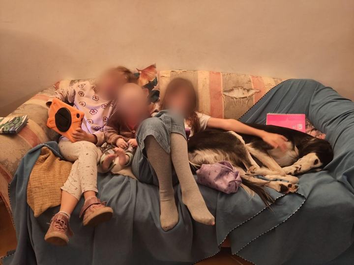 Three children on the sofa, Sagi asleep beside them